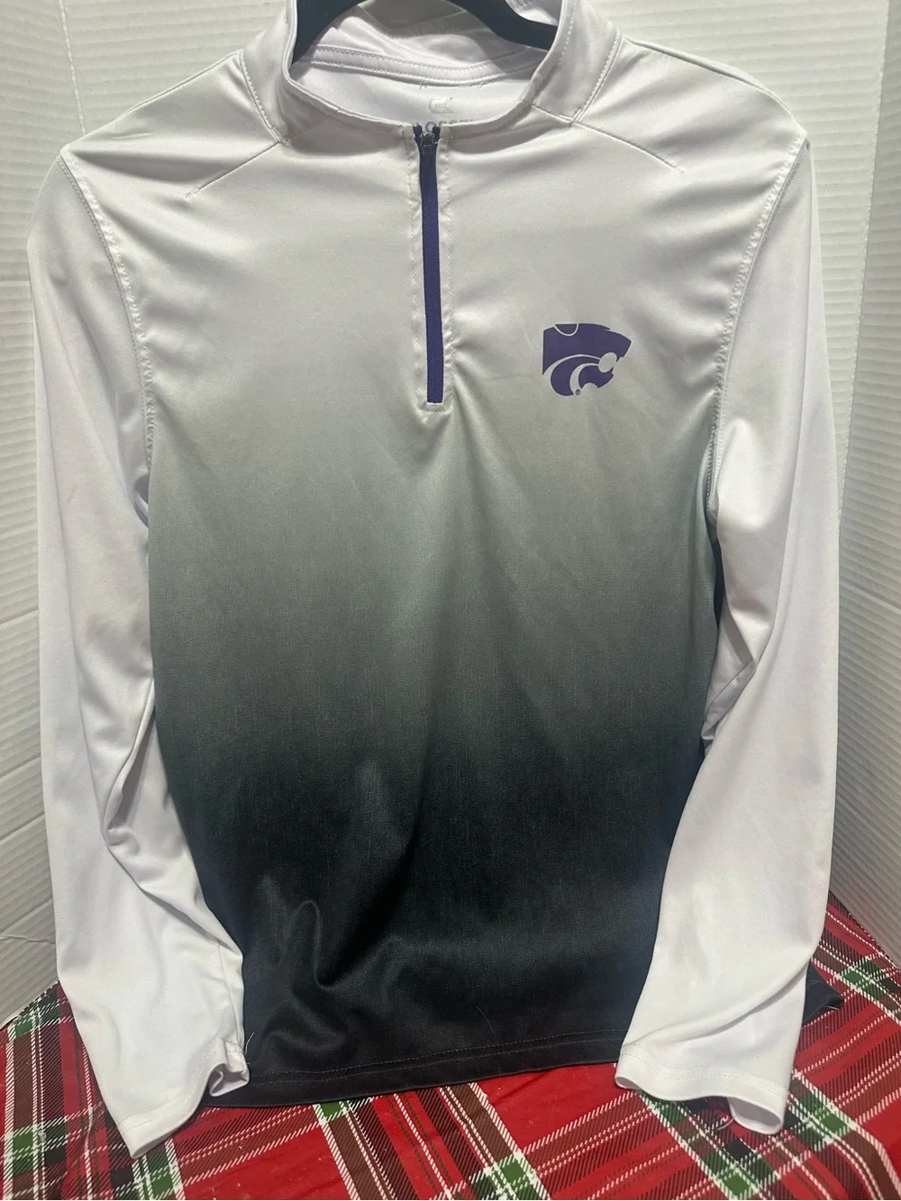 Two K-State Colosseum Youth XL quarter zips.